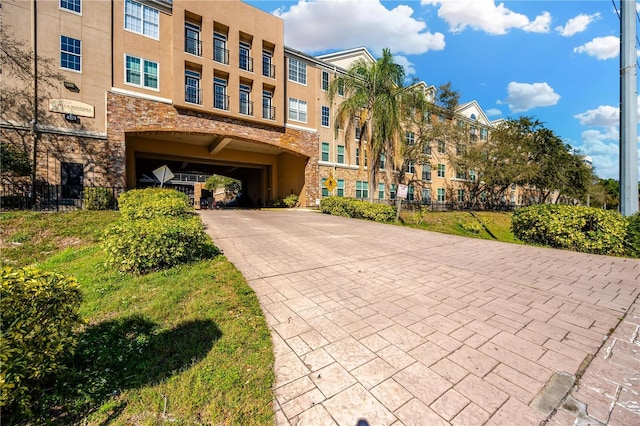 exterior space featuring decorative driveway