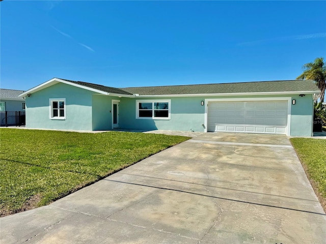 ranch-style home featuring a garage, a front yard, driveway, and stucco siding