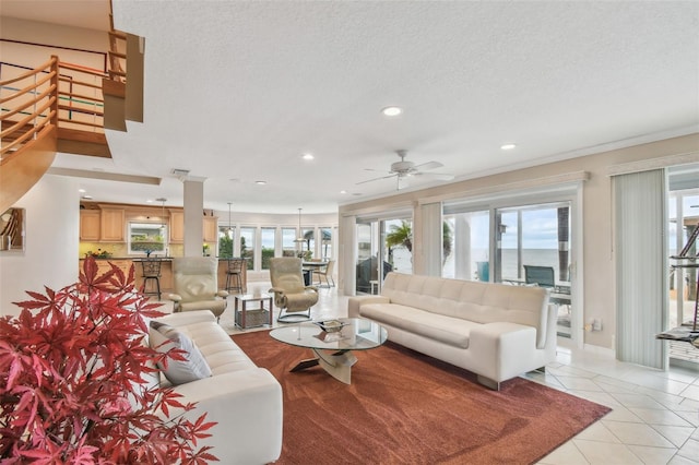 living room featuring light tile patterned floors, ceiling fan, a textured ceiling, and recessed lighting