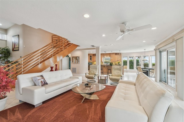 living area with ceiling fan, stairway, visible vents, and recessed lighting