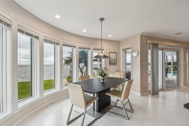 dining room featuring light tile patterned floors, recessed lighting, a wealth of natural light, and baseboards