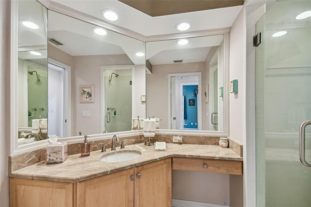 bathroom featuring recessed lighting, a shower stall, visible vents, and vanity