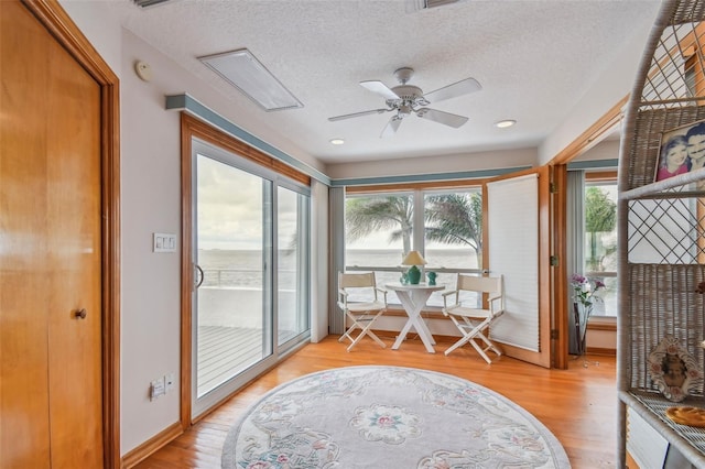 sunroom / solarium with ceiling fan