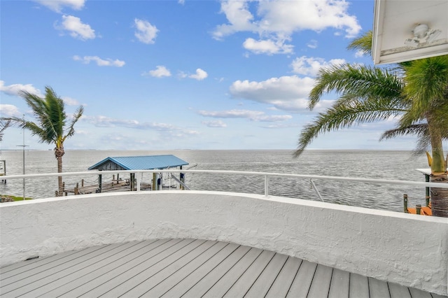 wooden deck with a water view