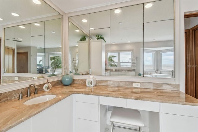 bathroom with vanity and recessed lighting