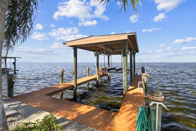 view of dock featuring a water view and boat lift