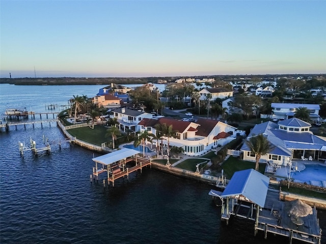 aerial view with a water view and a residential view