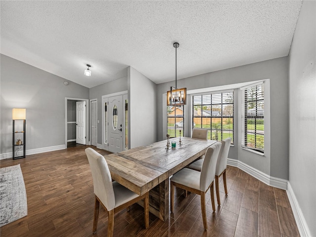 dining room with baseboards, a chandelier, vaulted ceiling, and dark wood-style flooring