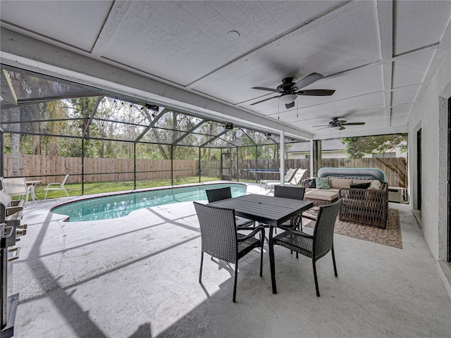 view of patio / terrace featuring a ceiling fan, a fenced in pool, glass enclosure, and a fenced backyard