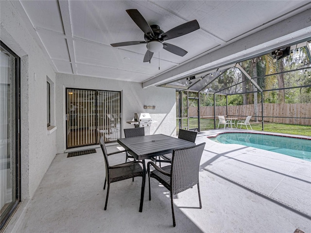 view of pool featuring a fenced in pool, a patio, a ceiling fan, fence, and a lanai