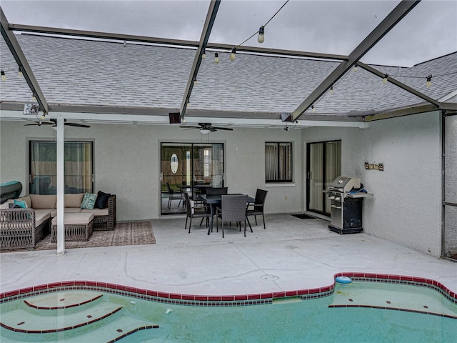 back of property with a patio, roof with shingles, an outdoor living space, and stucco siding