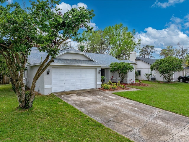 ranch-style home featuring driveway, a garage, a chimney, a front lawn, and stucco siding