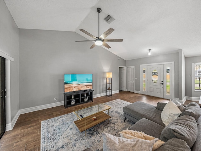 living room with visible vents, a ceiling fan, vaulted ceiling, wood finished floors, and baseboards