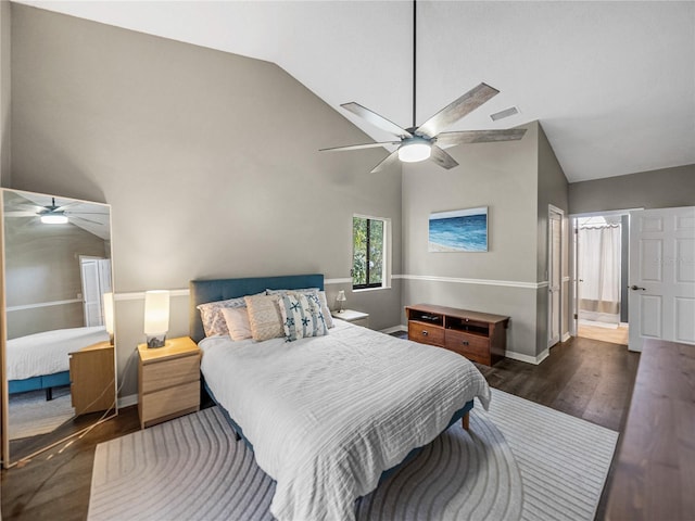 bedroom with baseboards, visible vents, a ceiling fan, wood finished floors, and high vaulted ceiling