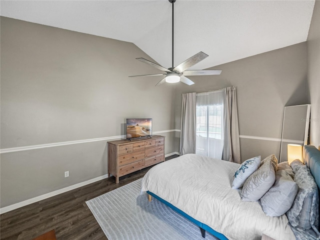 bedroom with ceiling fan, baseboards, vaulted ceiling, and wood finished floors