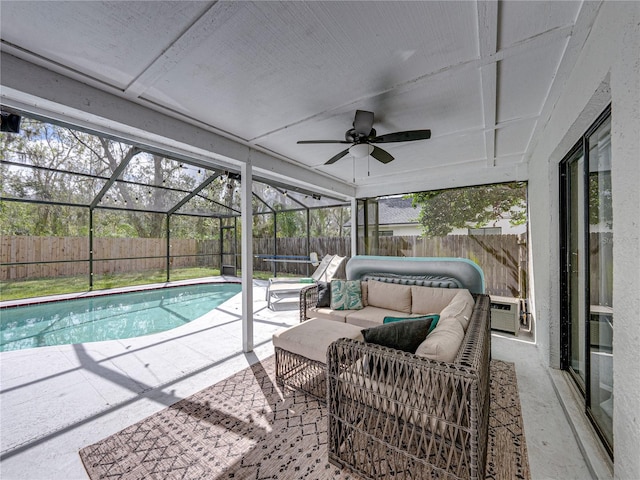 view of pool with a trampoline, an outdoor hangout area, a patio area, ceiling fan, and a fenced backyard