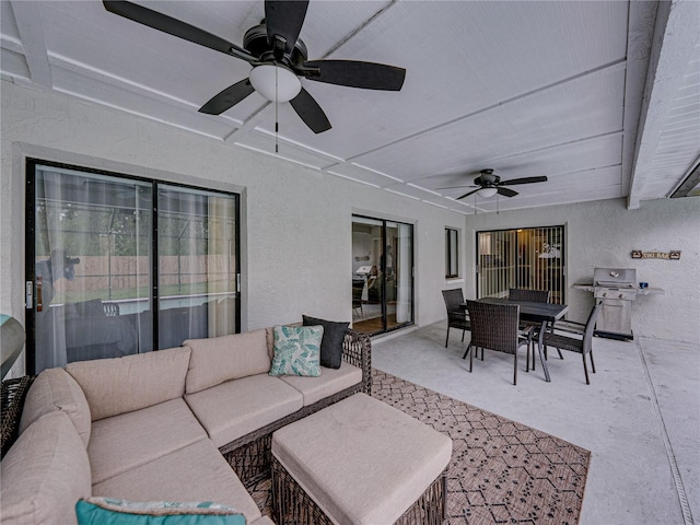 view of patio / terrace with ceiling fan, outdoor dining space, a grill, and an outdoor hangout area