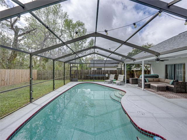 view of pool featuring a patio, a fenced backyard, a lanai, outdoor lounge area, and a fenced in pool