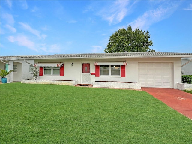 ranch-style home with a garage, driveway, a front yard, and stucco siding