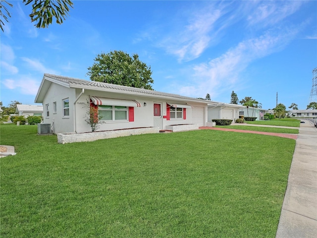 single story home with a garage, central AC unit, a front lawn, and concrete driveway