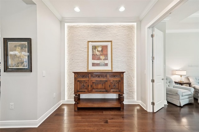 interior space with baseboards, ornamental molding, and dark wood finished floors