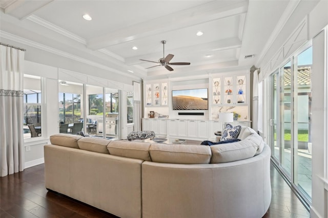 living area with ornamental molding, a wealth of natural light, dark wood-style flooring, and beam ceiling