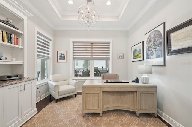 office featuring crown molding, light wood-type flooring, a notable chandelier, and baseboards