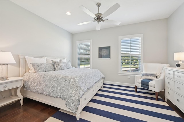 bedroom featuring ceiling fan, dark wood-style flooring, recessed lighting, and baseboards