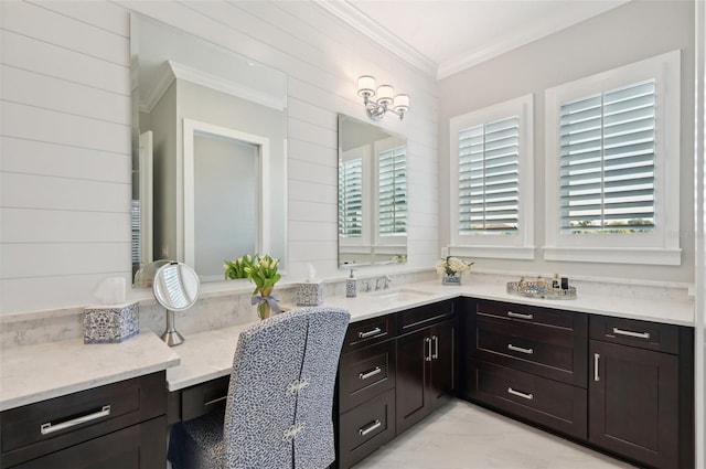 bathroom featuring marble finish floor, wood walls, vanity, and crown molding