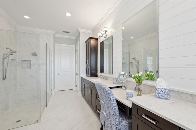 bathroom with marble finish floor, a marble finish shower, vanity, and crown molding