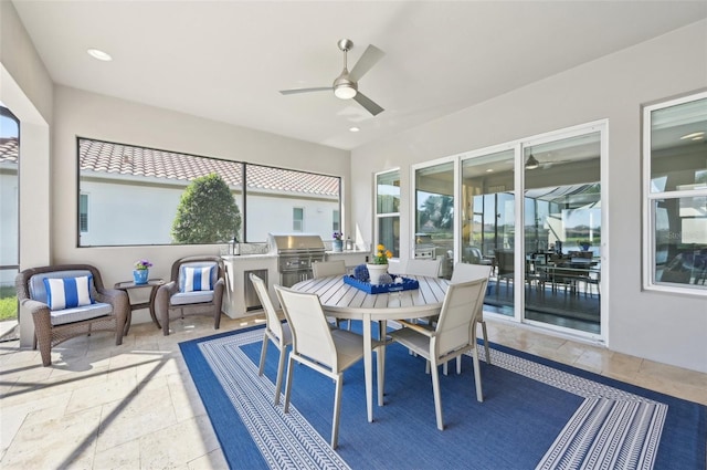 sunroom / solarium with a ceiling fan and plenty of natural light