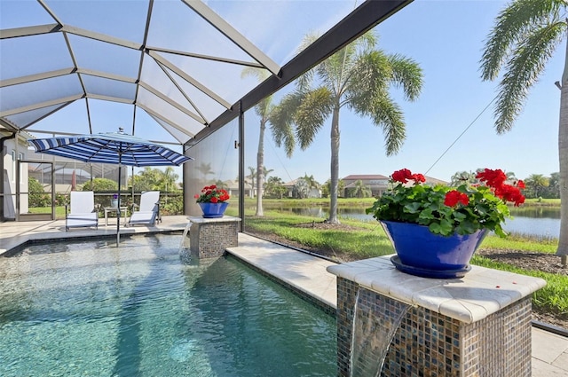 pool featuring glass enclosure, a patio area, and a water view