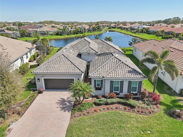 birds eye view of property featuring a residential view and a water view