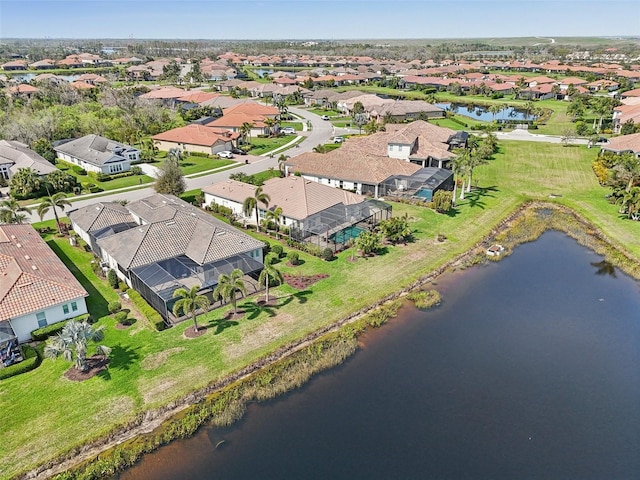 aerial view with a water view and a residential view