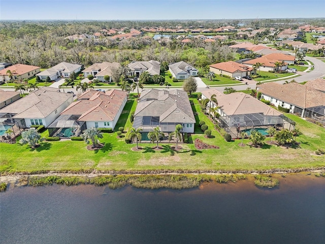 aerial view with a residential view and a water view