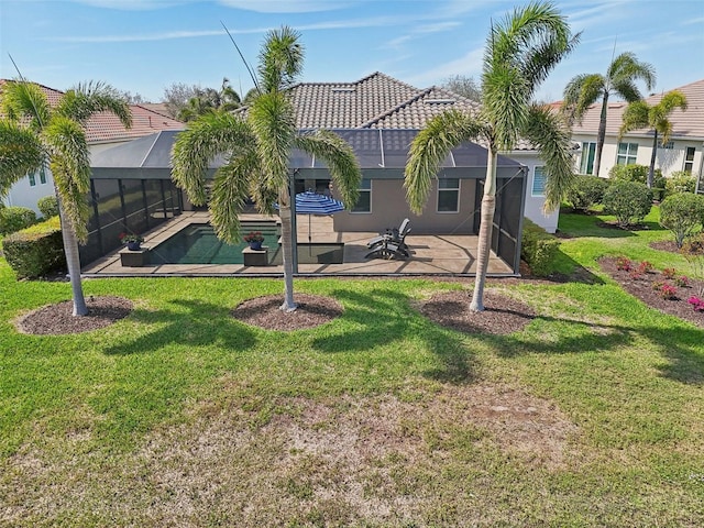 rear view of house featuring a tile roof, a patio, stucco siding, a lanai, and an outdoor pool