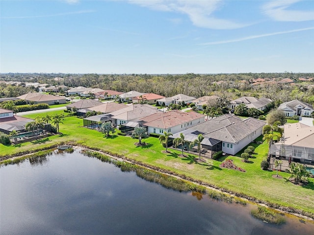 bird's eye view with a water view and a residential view