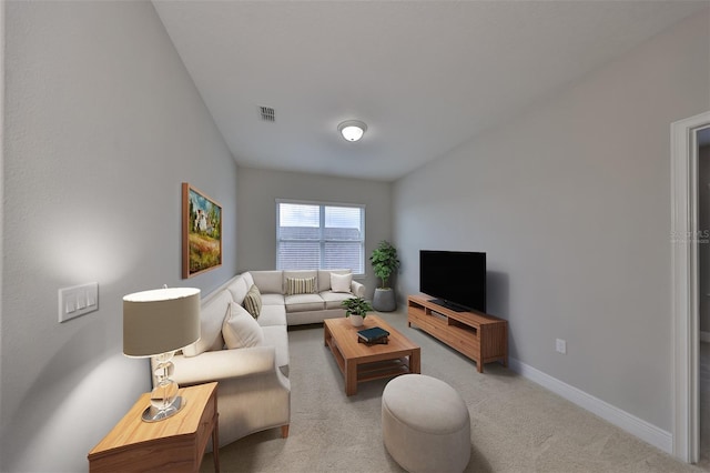 living room with light carpet, baseboards, and visible vents