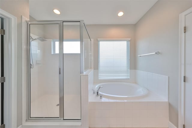 full bathroom featuring recessed lighting, a shower stall, and a bath