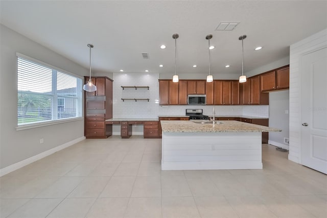 kitchen featuring stainless steel appliances, brown cabinets, visible vents, and light stone countertops