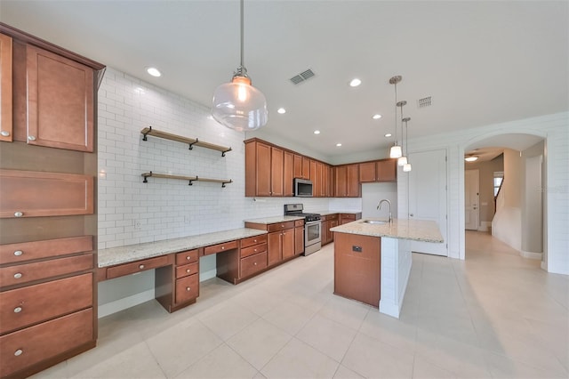 kitchen featuring arched walkways, stainless steel appliances, a sink, visible vents, and open shelves