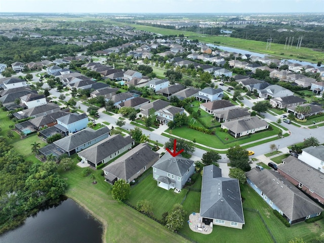 aerial view with a residential view and a water view