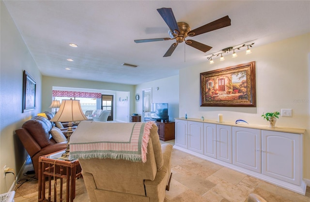 interior space with recessed lighting, stone finish flooring, visible vents, and baseboards