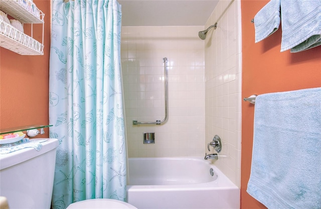 bathroom with toilet and shower / bath combo with shower curtain