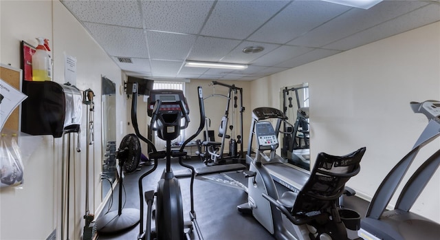 workout area featuring a paneled ceiling and visible vents