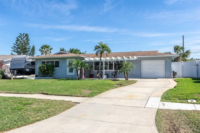 ranch-style house with driveway, a front lawn, an attached garage, and stucco siding