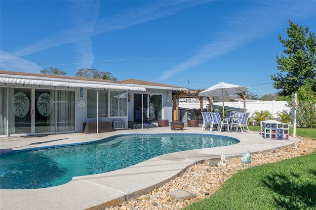 view of swimming pool featuring a patio area, fence, and a fenced in pool