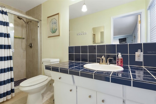 full bathroom featuring toilet, a stall shower, tasteful backsplash, and vanity