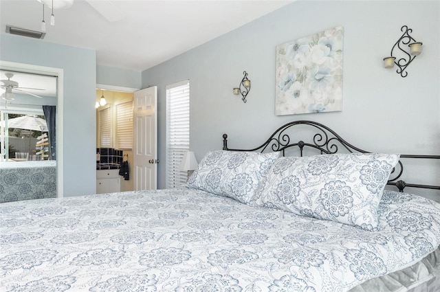 bedroom with visible vents and a ceiling fan