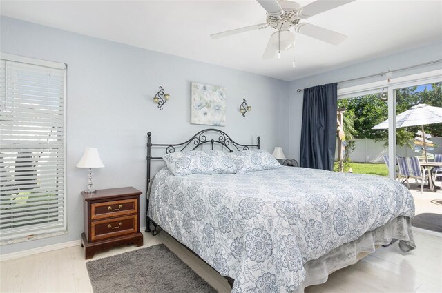 bedroom with light wood finished floors, access to outside, baseboards, and a ceiling fan